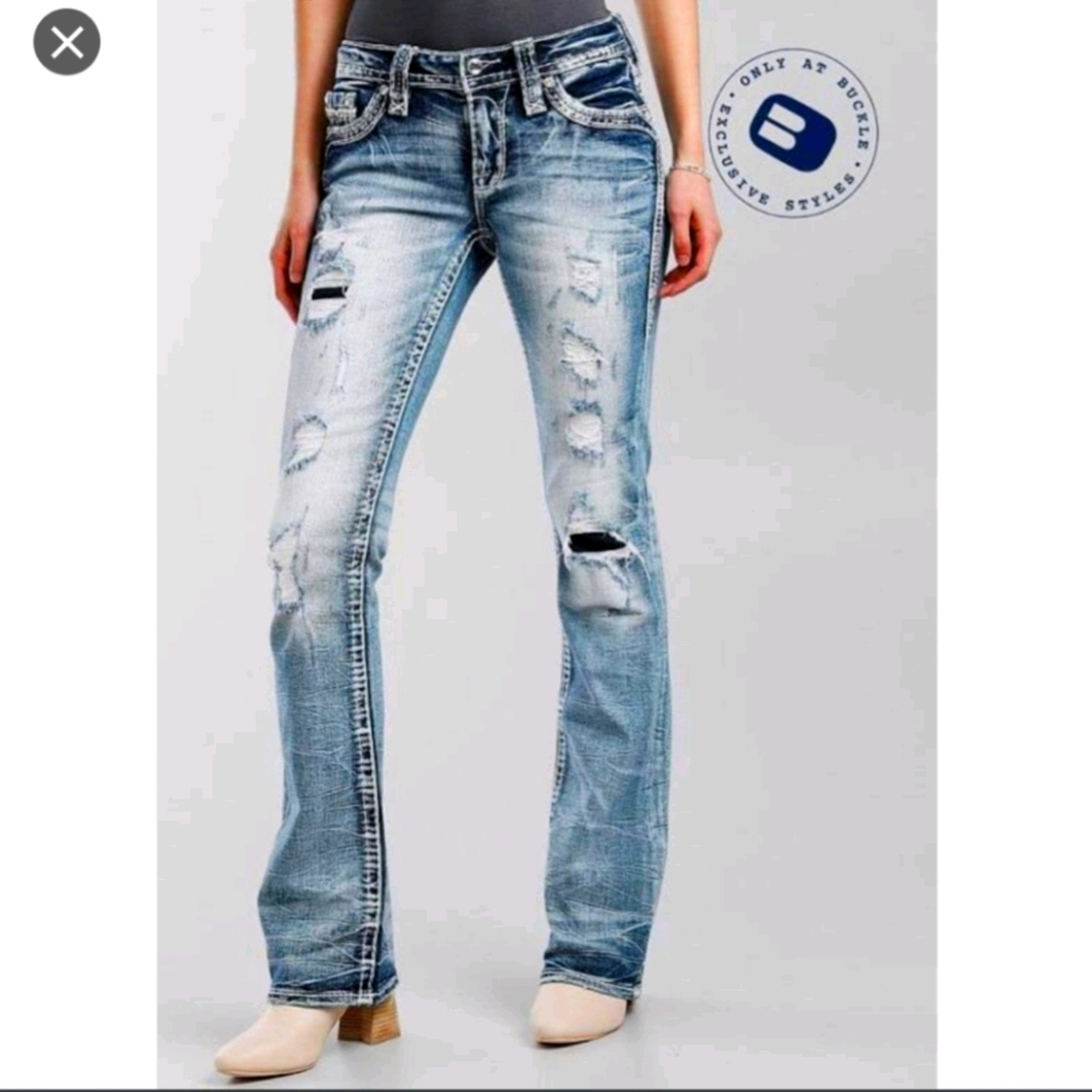 32 Rock Revivals boot cut distressed jeans